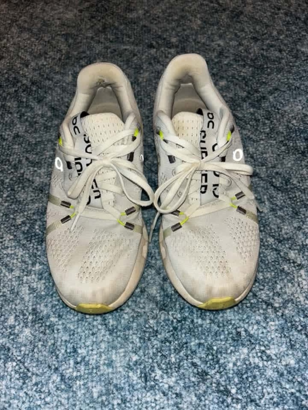 On Running Women’s White Athletic Shoes with Yellow Highlights